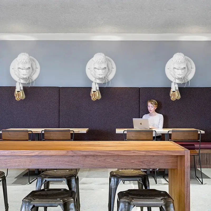 White sculpted monkey head wall lamp with exposed filament bulbs decorbites gorilla resin wall bedroom lighting