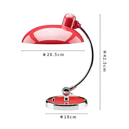 Red enamel engraving table lamp with curved chrome arm and circular base for office or bedroom use