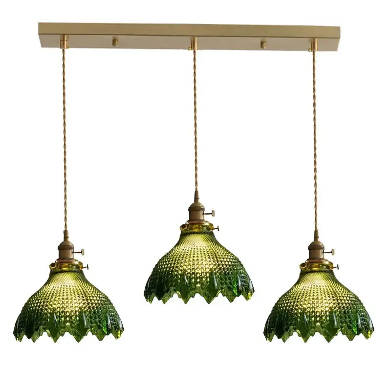 Three green textured glass pendant lights with brass fixtures and wood accent for dining room with e27 led bulb