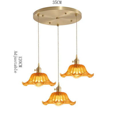 Golden amber glass pendant light with brass finish and petal design featuring wood accent for dining room with e27 led bulb