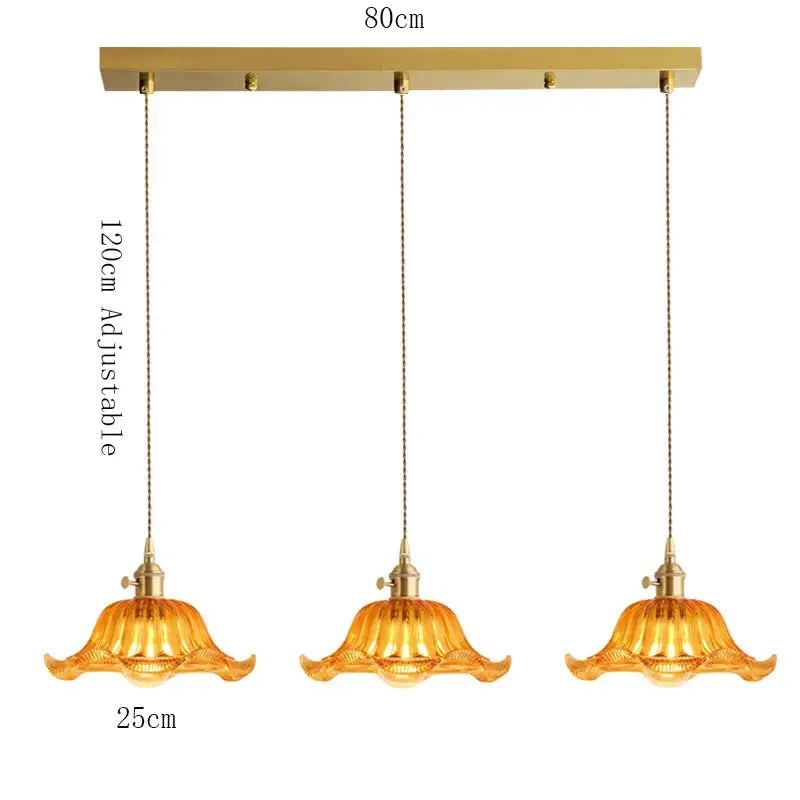 Gold-toned brass pendant light with amber glass shades, wood accent, and adjustable chains for dining room, e27 led bulb compatible