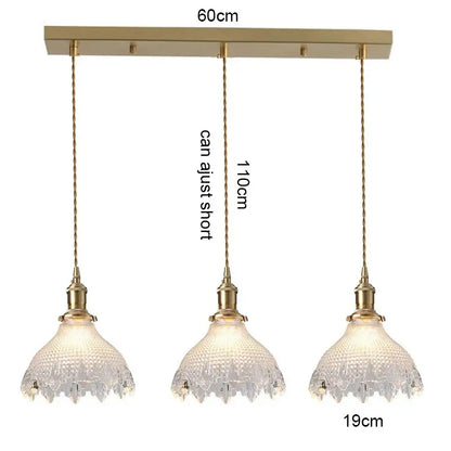 Gold-toned three-light pendant light with textured glass shades wood accent and adjustable cords for dining room e27 led bulb