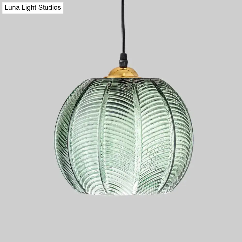 Retro green ribbed glass pumpkin dinette pendant lamp with leaf-like texture and brass fixture for dining room