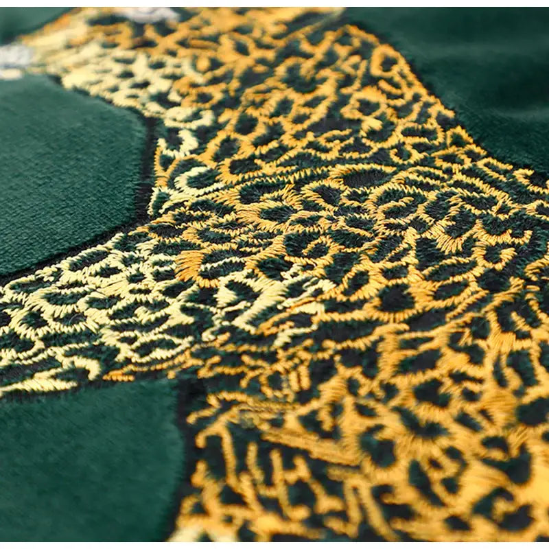 Retro green velvet embroidered leopard cushion cover featuring detailed gold and black leopard print embroidery