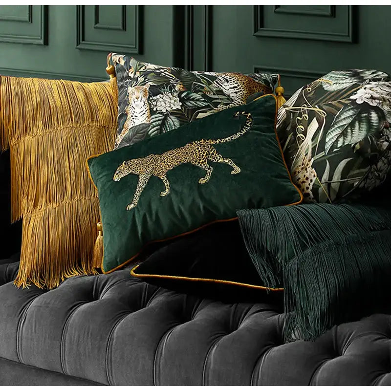 Emerald green velvet cushion cover with gold embroidered leopard design and matching tassels for living room decor