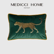 Emerald green velvet cushion cover with detailed embroidered leopard design and gold-trimmed edges for living room