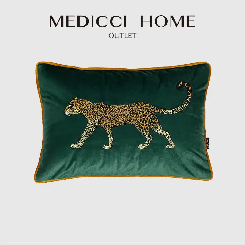 Emerald green velvet cushion cover with detailed embroidered leopard design and gold-trimmed edges for living room