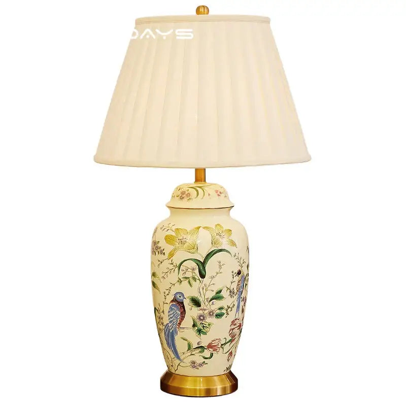 Cream-colored ceramic table lamp with retro hand-painted country flower bird motifs and gold-toned metal base decorbites country flower