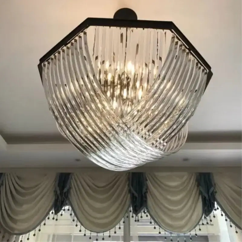 A modern retro hexagonal black metal e14 pendant light with cascading clear ribbed glass prisms for elegant decorbites decor