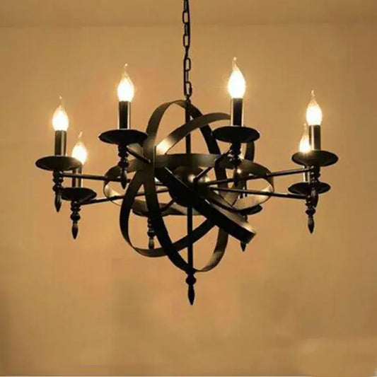Black decorbites iron chandelier with five lit candle-style bulbs and intricate spherical design for dining room lighting
