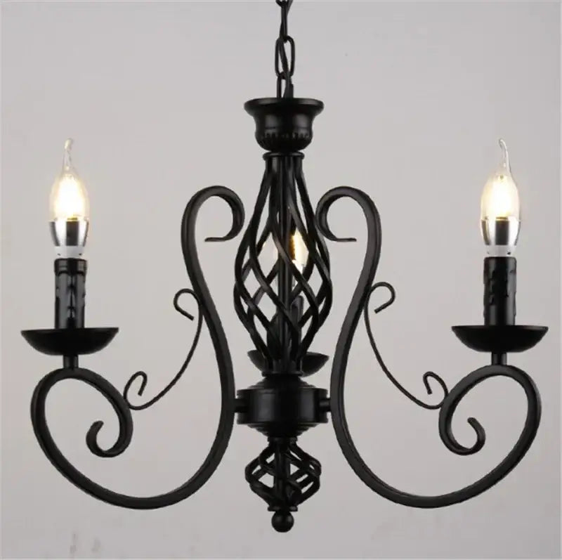 Retro industrial black wrought iron chandelier with ornate scrollwork and two lit candle-style bulbs for living room decorbites black wrought iron