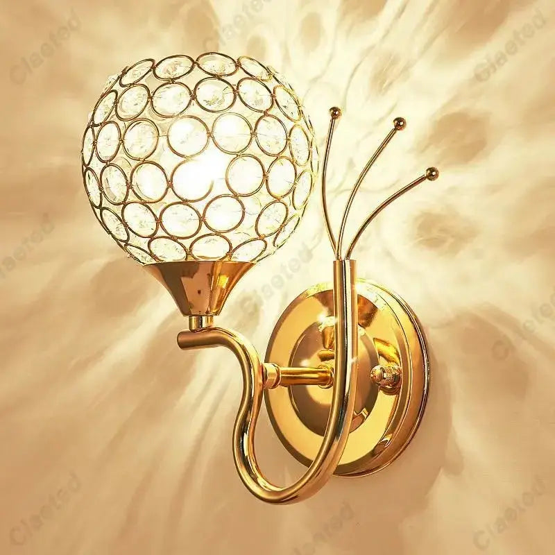 Retro industrial gold wall lamp sconce with spherical crystal globe and decorative curved arms for bedroom use