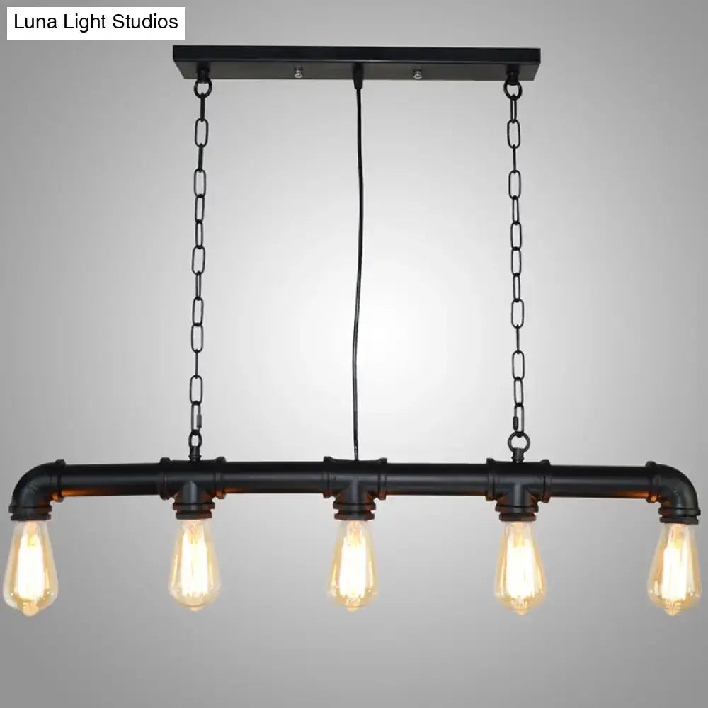Black metal tubular island pendant light with four exposed bulbs in retro industrial style for dining room