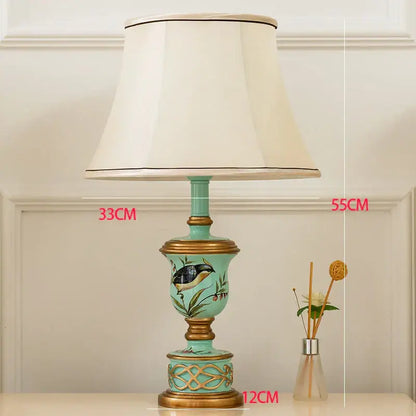 Retro mint green resin table lamp with butterfly detail featuring turquoise ceramic and gold accents for bedroom decorbites green resin table