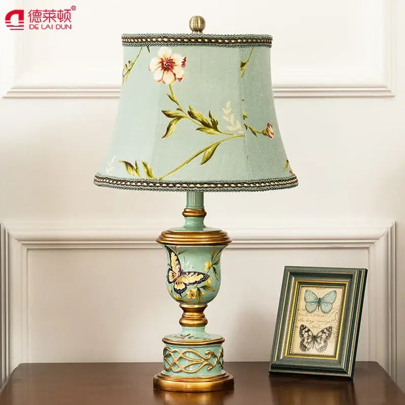 Delicate retro mint green resin table lamp with butterfly detail and gold accents for stylish bedroom decorbites green resin lighting