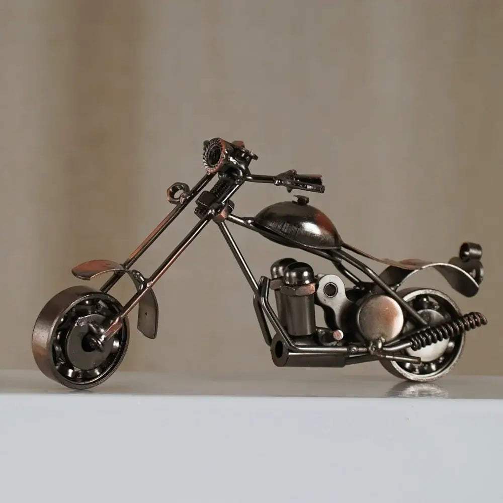 A metallic rustic-chic retro motorcycle model metal figurine crafted from repurposed parts for living room decor