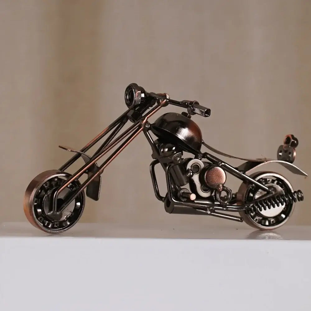 Detailed metal figurine of a retro motorcycle model in matte black and copper finish for living room decor