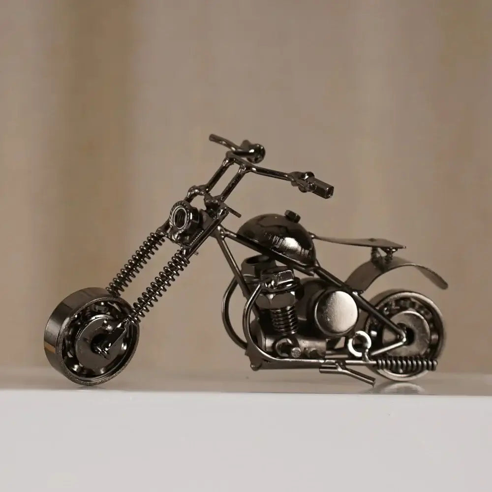 Black metal chopper retro motorcycle model metal figurine made from repurposed mechanical parts for living room decor
