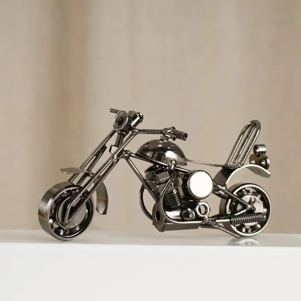 Shiny metallic chopper retro motorcycle model metal figurine crafted from repurposed parts for living room decor