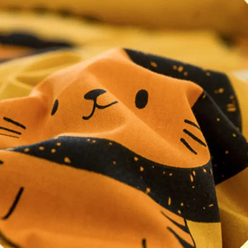 Retro mustard lion cotton floral double quilt featuring orange and black cartoon cat themed embroidered fabric design