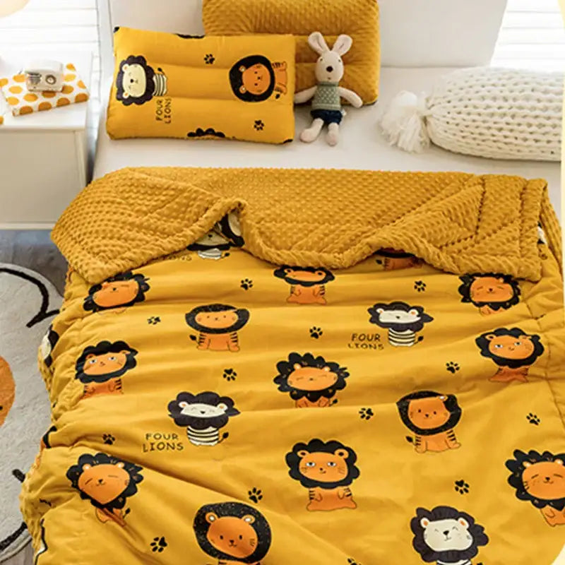 Yellow plush cotton floral double quilt with cartoon lion and paw print pattern featuring four lions text in black