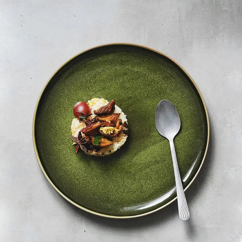 Retro olive green ceramic dinner plate with subtle textured finish and thin gold rim for elegant dining
