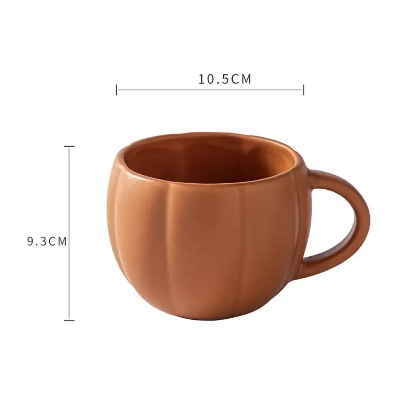 Retro orange pumpkin ceramic mug with vertical ridges and glossy finish featuring a retro enamel handle