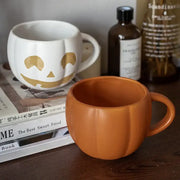 Orange halloween pumpkin ceramic mug with retro enamel handle in a pumpkin-shaped design for kitchen use