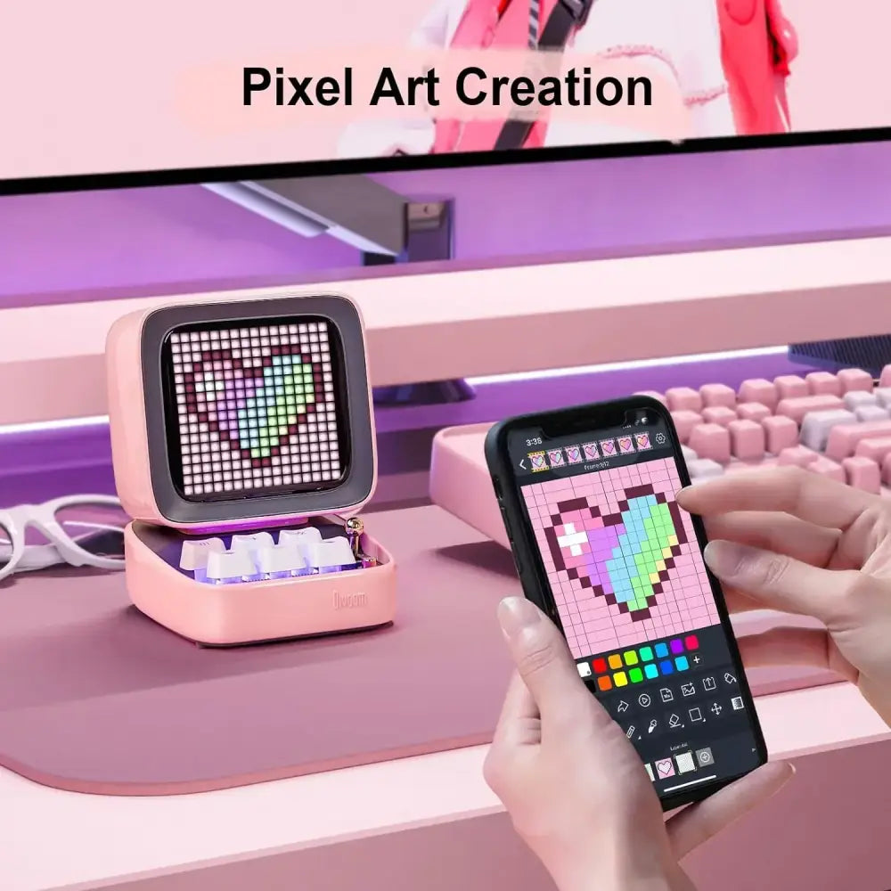 Retro pink pixel art game bluetooth speaker displaying a heart design on its ditoo pixel art grid screen