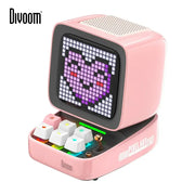 Retro pink pixel art speaker with led display showing a pixelated purple heart and colorful illuminated keys