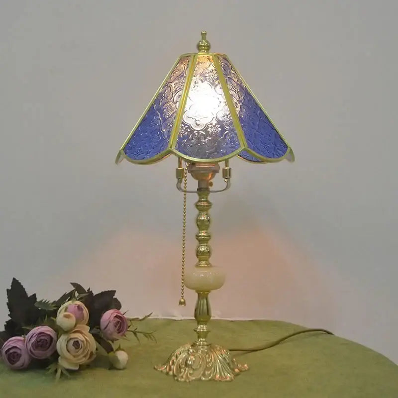 Blue stained glass desk lamp with ornate gold-toned brass desk lamp frame and vintage decorbites brass desk base