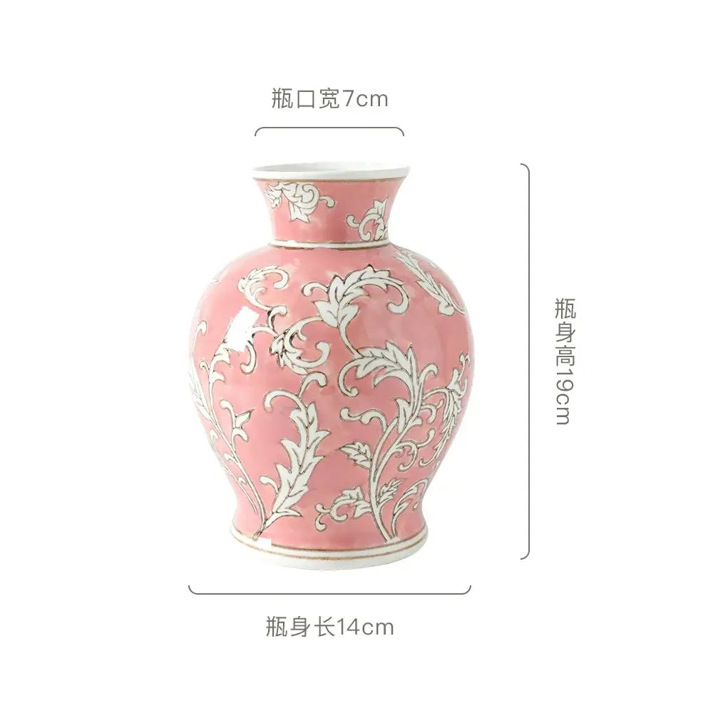 A delicate pink ceramic vase with intricate white floral patterns and gold trim for living room decorbites blue white style