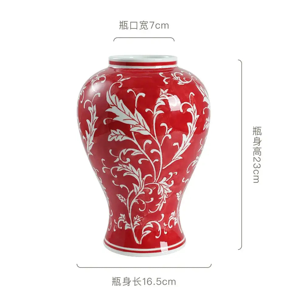 A glossy red ceramic vase with intricate white floral patterns and matching rim for living room decorbites blue white style