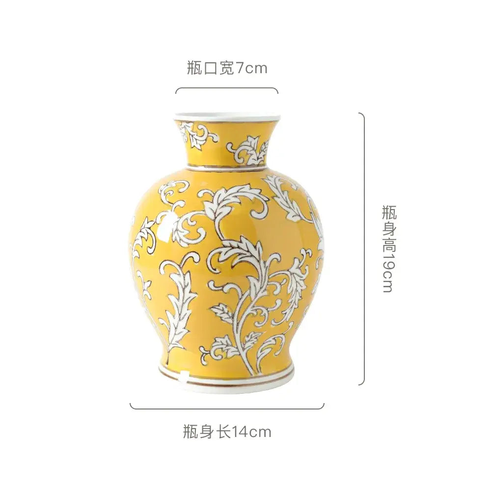 A vibrant yellow ceramic vase with intricate white floral patterns and glossy finish for living room decorbites blue white porcelain style