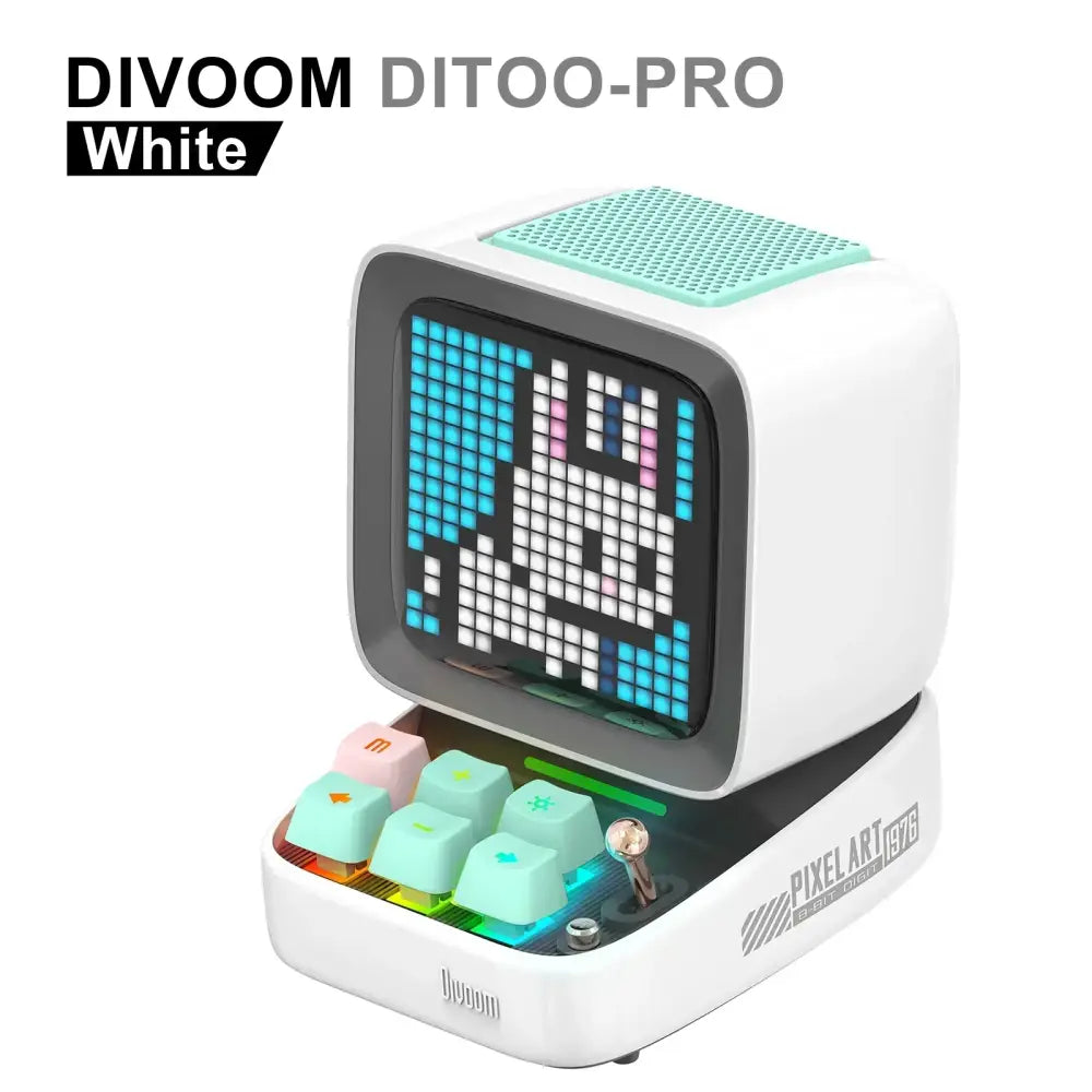 White divoom ditoo-pro retro pixel mini speaker with mint green grille and colorful illuminated keyboard keys for bedroom use