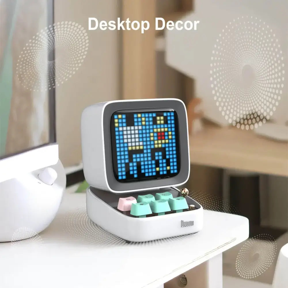 White retro pixel mini speaker and bedroom clock with blue yellow digital display and colorful mint green pink keycaps