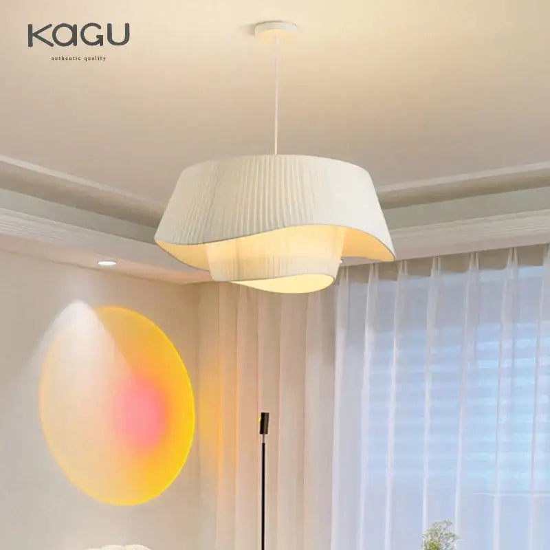 A modern decorbites cream fabric chandelier pendant light with pleated cream fabric and soft diffused glow