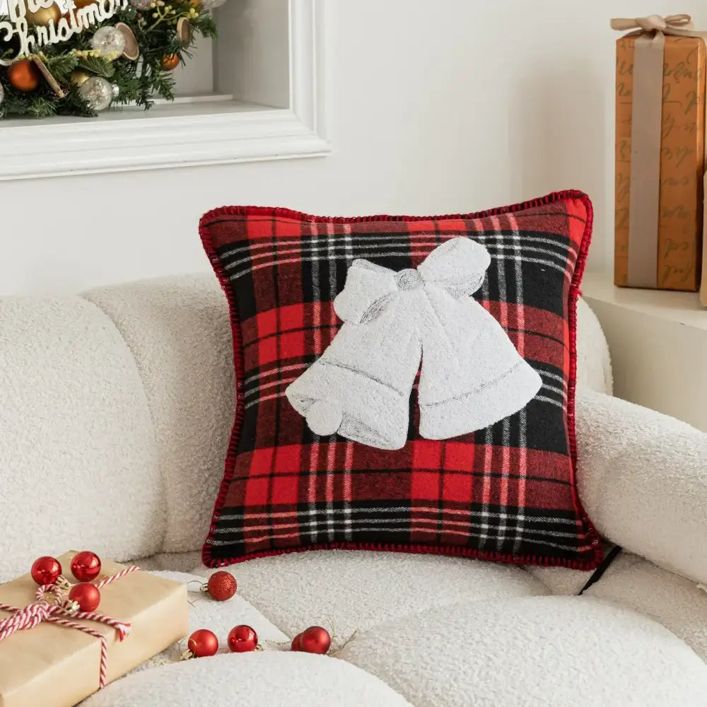 Retro red and green plaid pillow case with red and black plaid and white embroidered bow snowflake jingle bell design