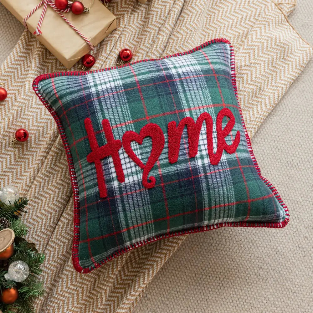 Cozy pillow case with red green plaid and home design featuring heart and red fringe for snowflake jingle bell decor