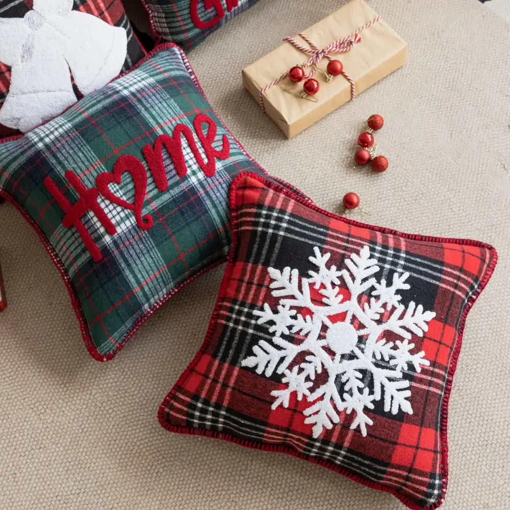 Red and black plaid pillow case with white snowflake jingle bell appliqué for retro living room decor