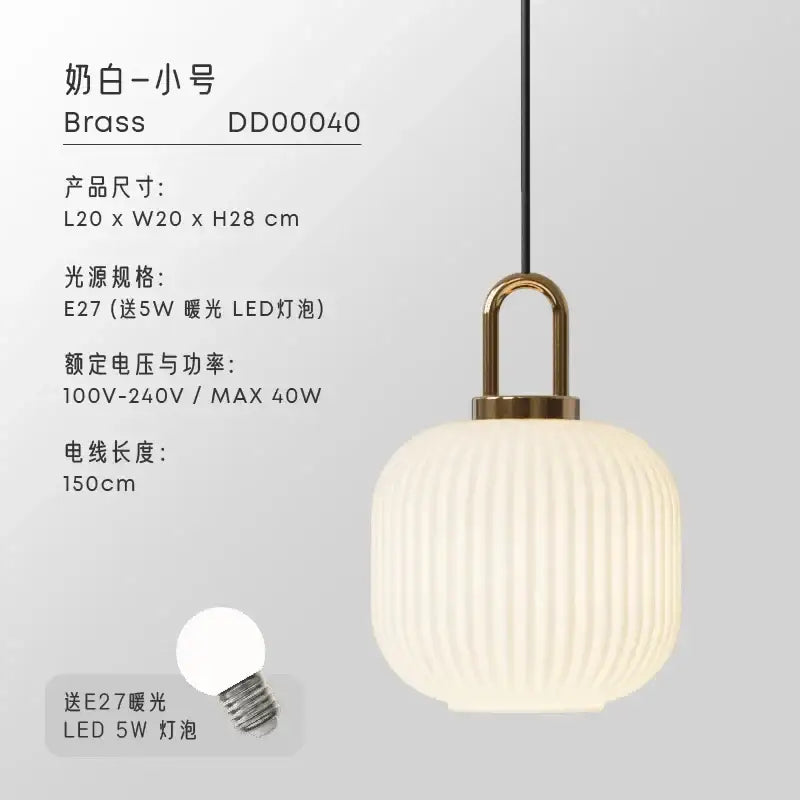 Cream-colored ribbed glass pendant light with brass-finished fixture and black cord for dining room pendant lights