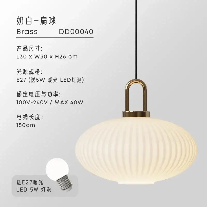 Cream-colored ribbed glass pendant light with a brass fixture ideal for dining room glass pendant lights