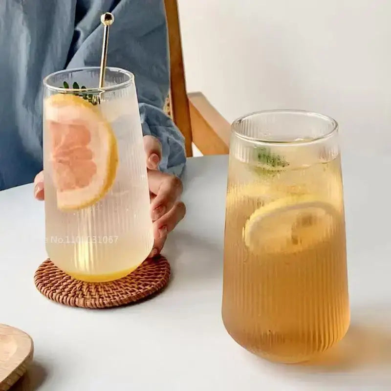 Retro ribbed clear glass coffee cup with ribbed texture featuring lemon slice and mint garnish for kitchen drinkware use