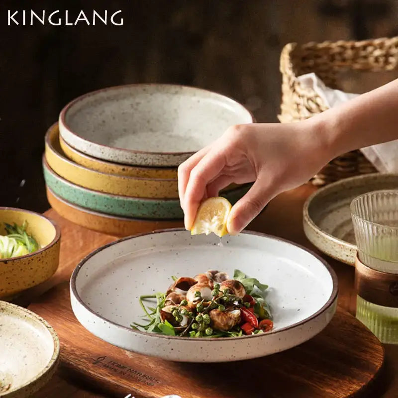 White speckled beige ceramic round plate with dark brown rim from kinglang decorbites ceramic round plate set