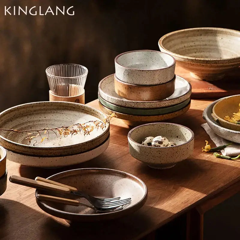 Kinglang decorbites ceramic round plate set features speckled beige earthy-toned ceramic round plates bowls and glass cup