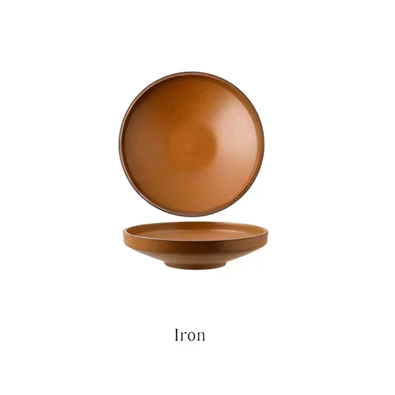 A rustic earth toned decorbites ceramic round plate with speckled glaze and raised rim from a round plate set
