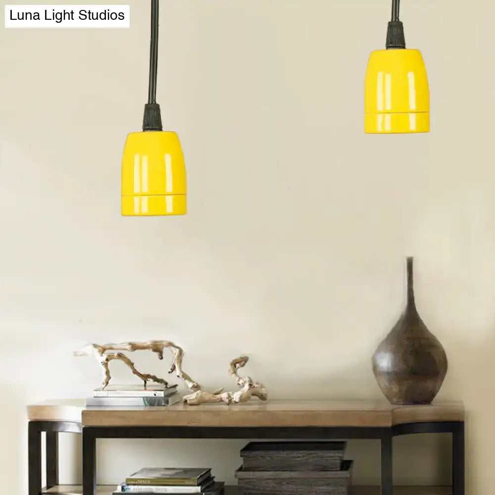 Bright yellow mini pendant light with adjustable black cord in retro style featuring black red ceramic ceiling fixture