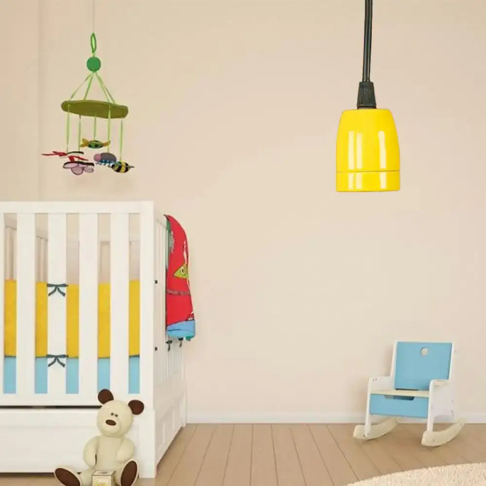 Bright yellow pendant light with sleek cylindrical design and black red ceramic adjustable cord by decorbites