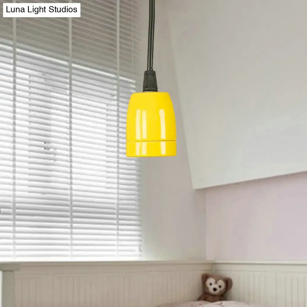 Bright yellow pendant light with sleek cylindrical design and black cord for DecorBites black red ceramic ceiling fixture