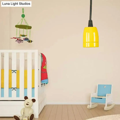 Bright yellow DecorBites™ pendant light with sleek cylindrical design, black red ceramic ceiling fixture, adjustable cord